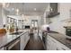 Modern kitchen with stainless steel appliances and lots of counter space, open to the living room at 307 Cedar Dust Dr, Decatur, GA 30030