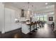 Modern kitchen featuring stainless steel appliances, a center island, and dark wood flooring at 307 Cedar Dust Dr, Decatur, GA 30030