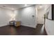 Contemporary living room with hardwood floors, neutral walls, and two stylish blue accent chairs at 307 Cedar Dust Dr, Decatur, GA 30030