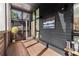 Inviting screened-in porch with wood decking and a view of the yard and surrounding area at 307 Cedar Dust Dr, Decatur, GA 30030