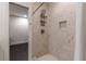 Modern shower with marble tile, a rainfall shower head, and a built-in niche for storage, offering a spa-like experience at 307 Cedar Dust Dr, Decatur, GA 30030