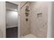 Stylish shower with white tiled walls, a built-in niche, and contemporary fixtures at 307 Cedar Dust Dr, Decatur, GA 30030