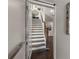 Open view of staircase with dark wood steps and a modern elevator on the right wall at 307 Cedar Dust Dr, Decatur, GA 30030