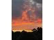 Scenic view of a colorful sunset over a lush green treeline, providing a sense of serenity and natural beauty at 307 Cedar Dust Dr, Decatur, GA 30030