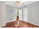 Bedroom with light grey walls, ceiling fan and dark hardwood flooring at 3178 Booths Ct, Dacula, GA 30019