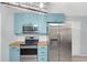 Modern kitchen features stainless steel appliances, updated cabinets, and butcher block countertops at 3178 Booths Ct, Dacula, GA 30019
