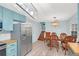 Eat-in kitchen with dining table and chairs and stainless steel refrigerator at 3178 Booths Ct, Dacula, GA 30019