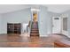 Spacious living room features a striking staircase and plenty of natural light at 3178 Booths Ct, Dacula, GA 30019