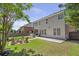 Spacious backyard featuring a patio, firepit area, and well-manicured lawn at 4765 Silver Leaf Dr, Cumming, GA 30040