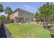 Large backyard with a patio, seating area, and lush green grass at 4765 Silver Leaf Dr, Cumming, GA 30040