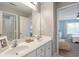 Bathroom with double sinks, a large mirror, and modern fixtures at 4765 Silver Leaf Dr, Cumming, GA 30040