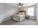 Bedroom features a ceiling fan, a neutral color scheme and carpet at 4765 Silver Leaf Dr, Cumming, GA 30040