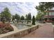Exterior shot of a fountain surrounded by manicured landscaping and upscale buildings at 4765 Silver Leaf Dr, Cumming, GA 30040