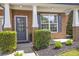 Inviting front porch with brick facade, neat landscaping, and a stylish front door, creating curb appeal at 4765 Silver Leaf Dr, Cumming, GA 30040