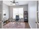 Comfortable home office with natural light, a ceiling fan, and an attractive accent rug at 4765 Silver Leaf Dr, Cumming, GA 30040