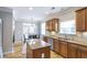Well-lit kitchen featuring granite countertops, stainless appliances, hardwood flooring, and breakfast area at 4765 Silver Leaf Dr, Cumming, GA 30040
