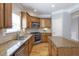Well-equipped kitchen featuring stainless appliances, granite countertops and custom wood cabinetry at 4765 Silver Leaf Dr, Cumming, GA 30040