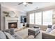 Comfortable living room featuring a fireplace, hardwood floors, built-ins, and lots of natural light at 4765 Silver Leaf Dr, Cumming, GA 30040