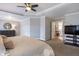 Spacious main bedroom features a ceiling fan, sitting area, and neutral decor at 4765 Silver Leaf Dr, Cumming, GA 30040