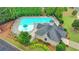 Overhead view of a community pool with lounge chairs, landscaped areas, and a pool house at 4765 Silver Leaf Dr, Cumming, GA 30040