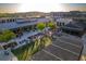 Aerial view of a town center featuring an outdoor event lawn, restaurants, and shops at 4765 Silver Leaf Dr, Cumming, GA 30040