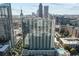 Stunning aerial view of the luxury building with city skyline backdrop at 860 Peachtree Ne St # 1411, Atlanta, GA 30308