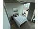 Cozy bedroom with a desk, a sleek floor mirror, and a comfortable bed with pillows at 860 Peachtree Ne St # 1411, Atlanta, GA 30308