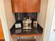 Attractive coffee bar featuring black subway tiles, granite countertop, and espresso machine at 860 Peachtree Ne St # 1411, Atlanta, GA 30308