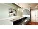 Stylish kitchen bar with granite countertop, modern lighting, and sleek black backsplash at 860 Peachtree Ne St # 1411, Atlanta, GA 30308