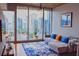 Comfortable living room with cityscape views, a modern sofa, and ample natural light at 860 Peachtree Ne St # 1411, Atlanta, GA 30308