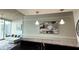 Open-concept living space with modern lighting and granite countertops at 860 Peachtree Ne St # 1411, Atlanta, GA 30308