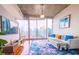 Bright living room with hardwood floors, cityscape views, and modern furnishings at 860 Peachtree Ne St # 1411, Atlanta, GA 30308