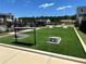Well-maintained community area with artificial turf and cornhole, perfect for outdoor fun at 1248 Windmill Pkwy # 240, Cumming, GA 30041