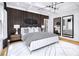 This main bedroom features a coffered ceiling, wood accent wall, and bright natural light at 1248 Windmill Pkwy # 240, Cumming, GA 30041