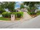 Inviting curb view with manicured bushes and an elegant driveway leading to a well-maintained home at 65 Wisteria Blvd, Covington, GA 30016