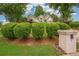 Charming home with lush landscaping and mature trees providing privacy and enhancing its curb appeal at 65 Wisteria Blvd, Covington, GA 30016