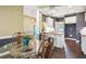 Spacious eat-in kitchen with bar seating, stainless appliances, and views to the dining area at 65 Wisteria Blvd, Covington, GA 30016