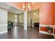 Bright living area featuring high ceilings, stylish trim, and hardwood floors providing ample room for entertaining at 65 Wisteria Blvd, Covington, GA 30016