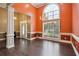 Bright and airy living room with high ceilings, detailed trim, and large window, creating a welcoming atmosphere at 65 Wisteria Blvd, Covington, GA 30016