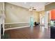 Open living room with soaring ceilings, wood floors, and a fireplace, offering a comfortable and inviting space at 65 Wisteria Blvd, Covington, GA 30016