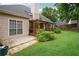 Charming patio area with stepping stones and mature landscaping, offering a serene outdoor space at 65 Wisteria Blvd, Covington, GA 30016
