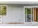 Backyard featuring wood deck with sliding glass door, and view of many trees at 6595 Oakwood Dr, Douglasville, GA 30135