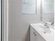 Bathroom with white vanity, modern faucet, framed mirror, and neutral wall color at 6595 Oakwood Dr, Douglasville, GA 30135