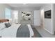 Staged bedroom with adjacent bathroom and decor at 6595 Oakwood Dr, Douglasville, GA 30135