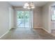Bright dining area featuring sliding glass doors leading to an outdoor deck for easy entertaining at 6595 Oakwood Dr, Douglasville, GA 30135