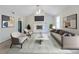 Inviting living room with a cozy fireplace, vaulted ceiling, and stylish modern decor at 6595 Oakwood Dr, Douglasville, GA 30135