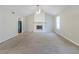 Spacious living room featuring a classic fireplace, neutral paint, carpet and natural light at 6595 Oakwood Dr, Douglasville, GA 30135