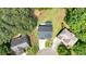 Aerial view displays property's driveway, landscaping, roof, and neighboring homes in a residential area at 209 Wildwood Way, Canton, GA 30114