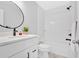 Bright bathroom with a modern vanity, shower and tub combination, and a neutral color scheme at 209 Wildwood Way, Canton, GA 30114