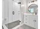 Modern bathroom featuring a glass-enclosed shower and white vanity with stylish mirror and lighting at 209 Wildwood Way, Canton, GA 30114